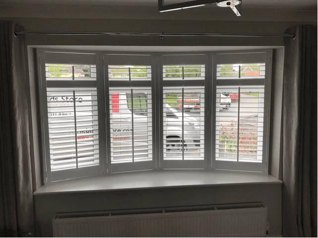 Classic five-panel bay shutters