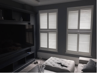 White shutters on two living room windows