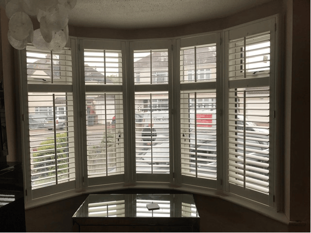 Tier-on-tier shutters on a bay window