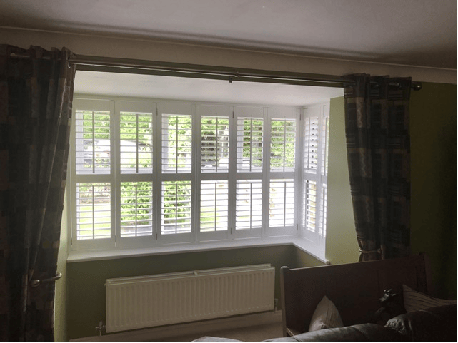 White shutters across a wide bay